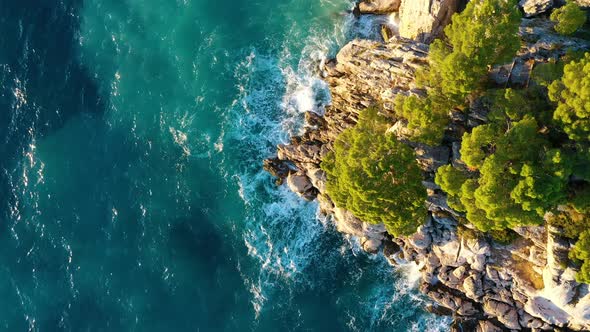 Aerial view on rocks and forest. Vacation and adventure. Rocks and turquoise water