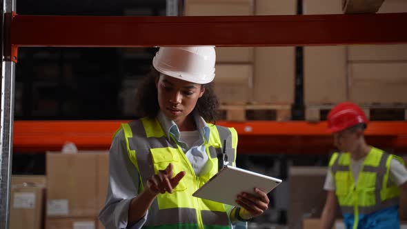 Warehouse Employee Taking Inventory on Tablet