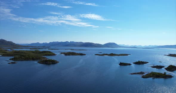 Arial pan over small Norwegian harbor with panoramic view over small islands in Ringstad bo I Vester