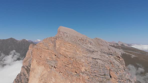 Aerial Shot of Mountain Peaks Among the Clouds, the Vertigo Effect