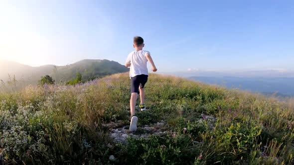 Boy Running in The Mountains.