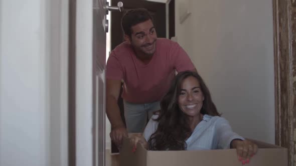 Funny Long-haired Lady Sitting Inside Carton Box