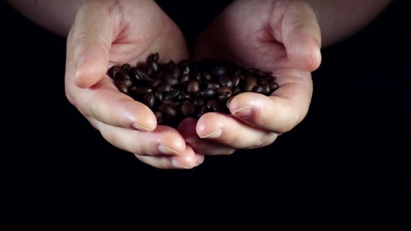 Coffee beans in hands