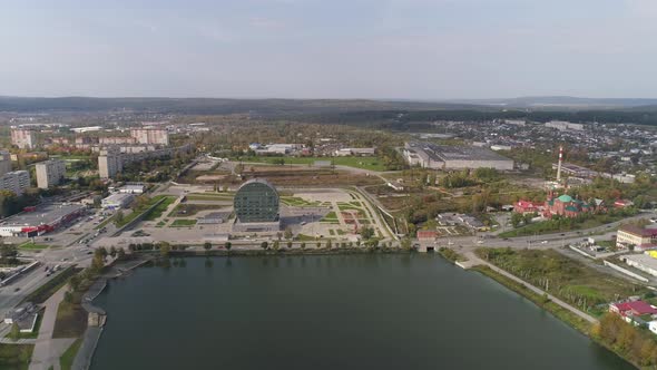 Aerial view of Modern building in the city in the form of a washer 01