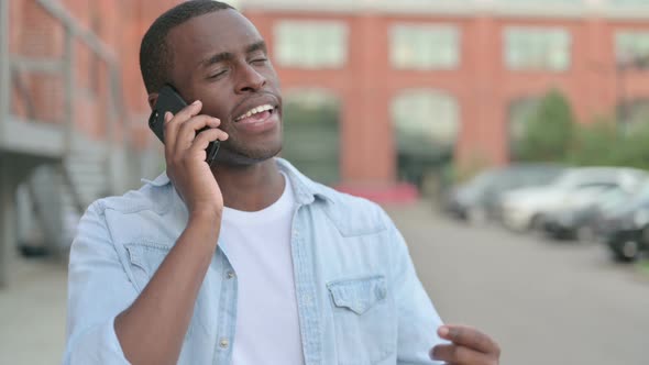 Outdoor African Man Talking on Phone