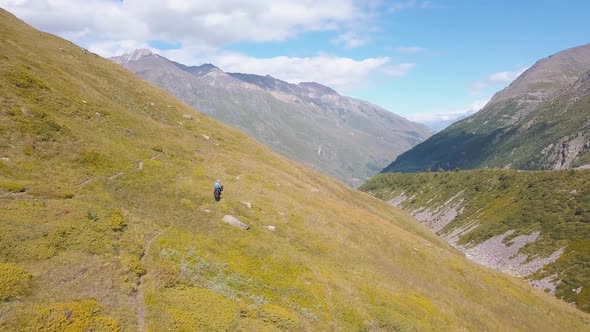 Top view of man riding horse in mountains