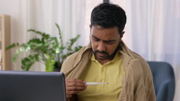 Sick Man Thermometer Having Video Call on Laptop