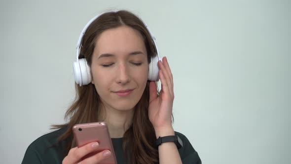 Portrait of Attractive Cheerful Woman Listening Single Hit Using Device