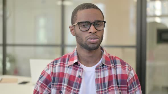 Portrait of African Man Showing No Sign By Finger Denial