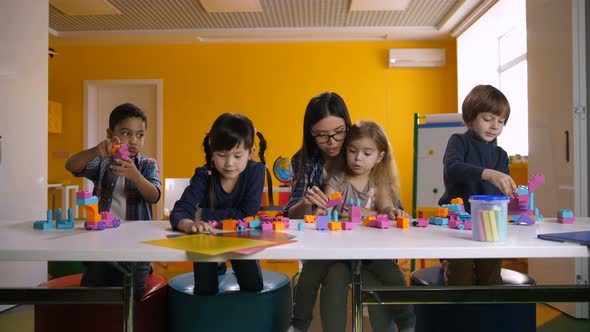 Kids Playing with Construction Blocks in Classroom