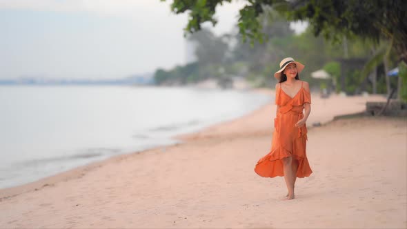 Asian woman enjoy around beautiful beach sea ocean