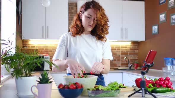 Young Woman at Home in Kitchen Tells Recipe on Camera