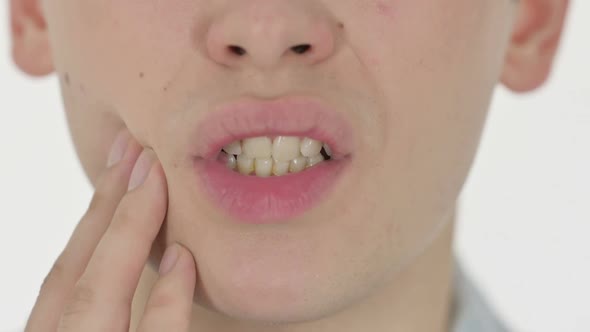 Close Up of Mouth With Toothache on White Background