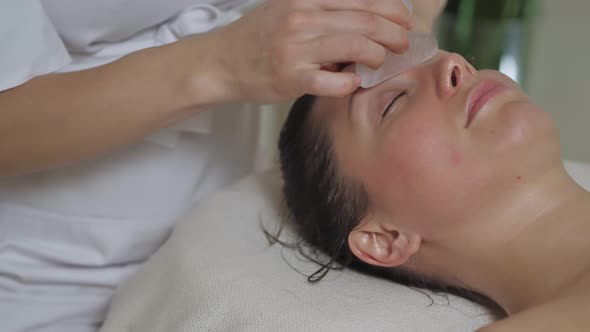 Face Massage with Gouache Stones at the Spa