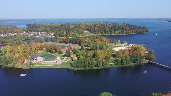 Aluksne Lake  Island Pilssala With Park and Castle Ruins in Latvia. Autumn Aerial 4K Landscape Shot