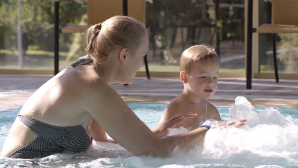 Mother and her son in the swimming pool