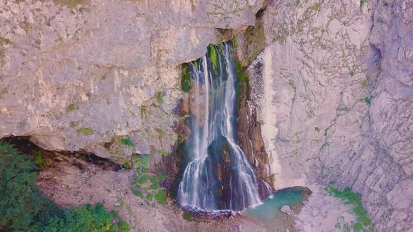 Waterfall Gega - Flows From the Rock. Summer, Green Trees , Cascade. Shooting From a Drone