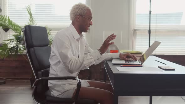 Man in Shirt and Underpants Holds Online Meeting By Means at Home