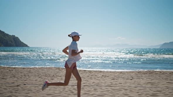 Young Women are Exercising with Outdoor Running with a Sea Background