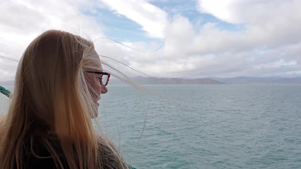Beautiful Blonde Lady Enjoying the Sea View From the Vessel