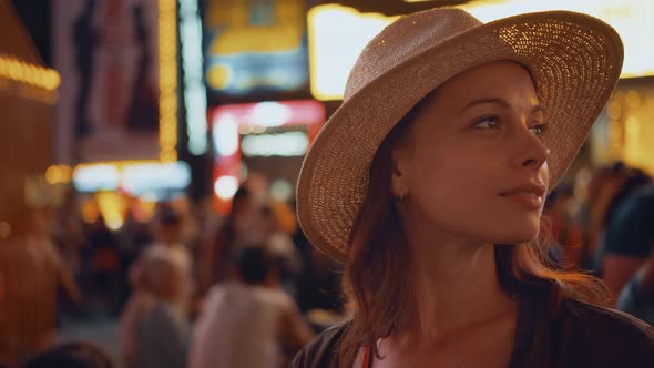 Smiling woman in Times Square in New York City