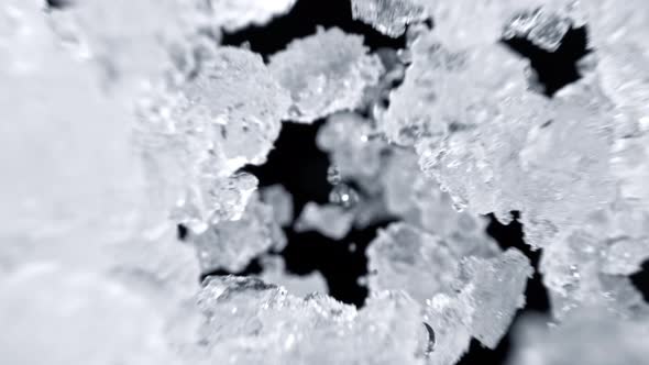 Super Slow Motion Shot of Falling Crushed Ice on Black Background at 1000Fps