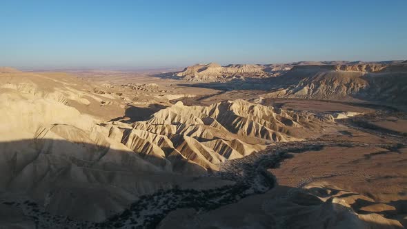 Aerial footage at Sde Boker, in Neguev desert of Israel. Dry river in the desert landscape.