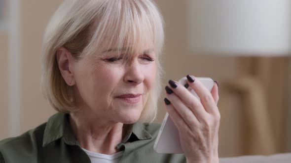 Closeup Old Lady Mature Aged Female Grandmother Caucasian Retired Woman Looking at Phone Screen