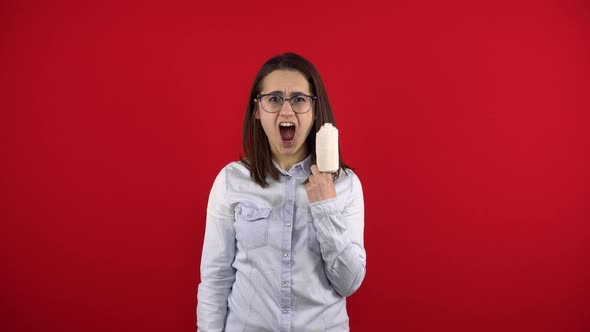 Young Woman Screaming with Rewind Bandage Finger and Shouts