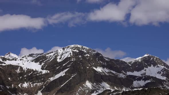 Louds Over Tops of Snow-capped Mountains in Alps