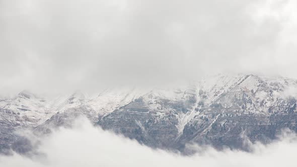 Clouds moving in front of Timpanogos Mountain in time lapse