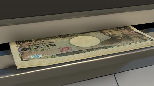 10000 Japanese yen in cash dispenser. Withdrawal of cash from an ATM.