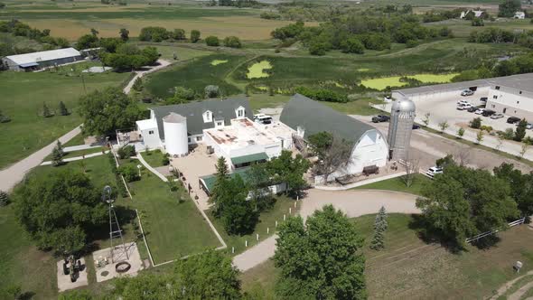 Aerial view of a white building with a gray roof in Bismarck on a sunny day