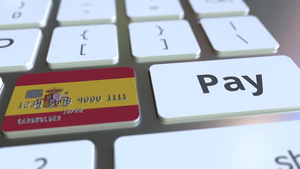 Credit Card with Flag of Spain As a Key on a Keyboard alt