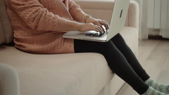 Senior Woman Using Laptop Computer.Elderly Woman Online Meeting With Grandchildren On Social Network