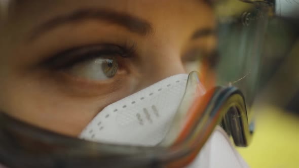 Macro Eye View of Sad Female Paramedic Feeling Alert with Blue Lights Blinking