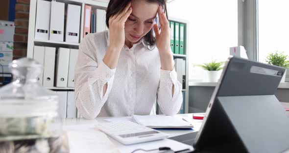 Thoughtful Upset Woman at Workplace in Office