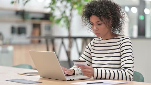 Online Shopping By African Woman on Laptop in Office