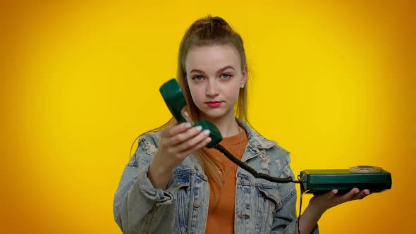 Cheerful Teen Girl Secretary Talking on Wired Vintage Telephone of 80s Says Hey you Call Me Back