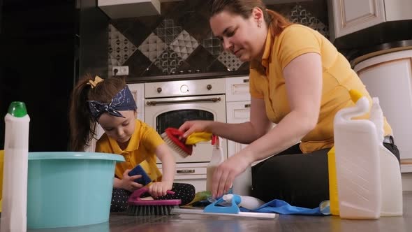 Mother and Daughter Clean Houses They Sit on the Floor and Clean the Laminate