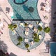 Fly Over a Large Pool with Blue Water and a Lot of Tourists in Hot Weather - VideoHive Item for Sale