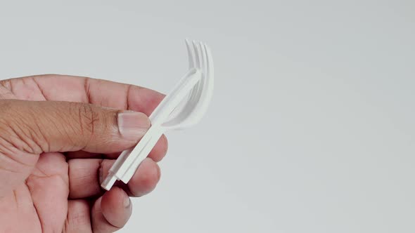 Hand Holds Folding Plastic Fork 