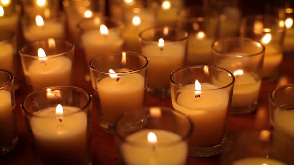 Rows of candles in a church or temple.