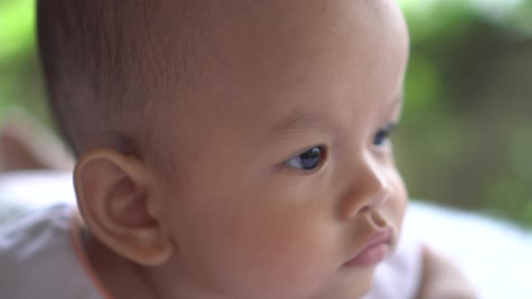 Happy portrait baby boy playing alone