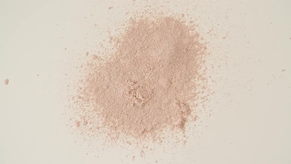 Powder Particles of Cosmetics Fall on the Table