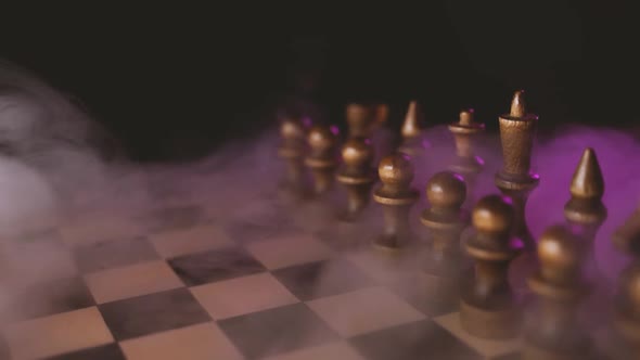 Close Up of White Chess Pieces on Board with Dissipating Steam