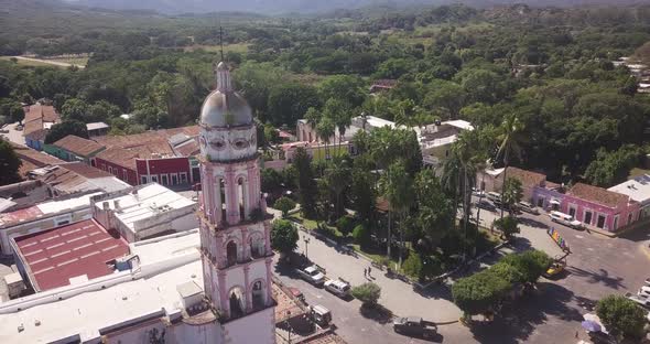 Aerial of picturesque tower of Parish of Santa Úrsula church in little town of Cosala, tourist attra