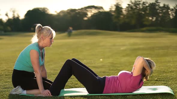 Lady Doing Abdominal Crunches Exercise on Mat