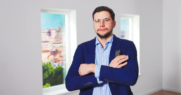 Camera Approaching Young Tall Happy Caucasian Man Real Estate Agency Manager Standing in Empty House