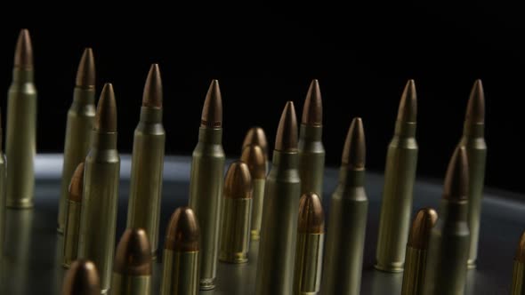 Cinematic rotating shot of bullets on a metallic surface - BULLETS 074